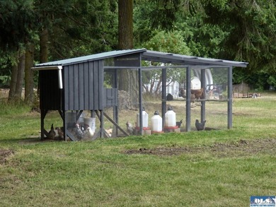 Tucked among mature trees and lovingly maintained, this inviting - photo 20