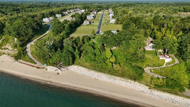 Located in the gated Beverly Beach enclave , this traditional - photo 2