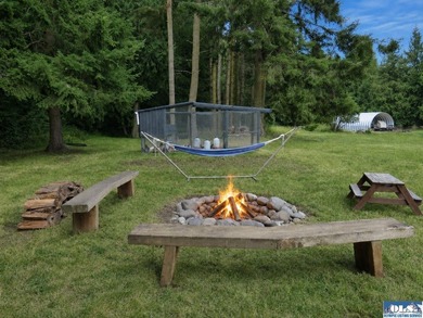 Tucked among mature trees and lovingly maintained, this inviting - photo 22