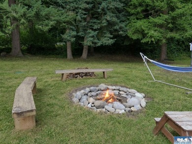 Tucked among mature trees and lovingly maintained, this inviting - photo 23