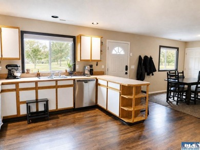 Tucked among mature trees and lovingly maintained, this inviting - photo 30
