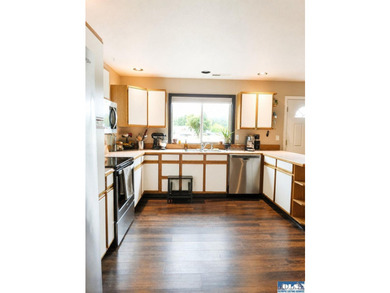 Tucked among mature trees and lovingly maintained, this inviting - photo 31