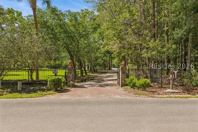 Tucked behind wrought iron gates on over four private, fenced - photo 4