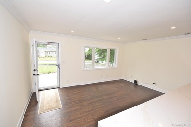 The stunning brand-new eat-in kitchen is the heart of the home - photo 4