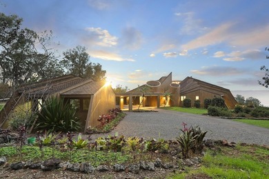 This 10 acre Piiholo property at 4,000' elevation borders a - photo 1