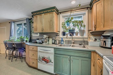 Welcome to this charming West Jordan home featuring 4 spacious