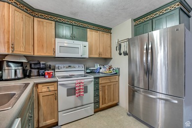 Welcome to this charming West Jordan home featuring 4 spacious