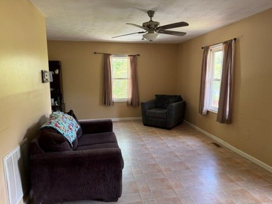This charming 2-bedroom, 1-bath home offers low-maintenance - photo 2