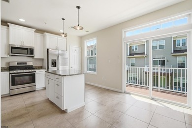 Welcome home to this spacious 3-bedroom, 3.5-bath townhouse - photo 2