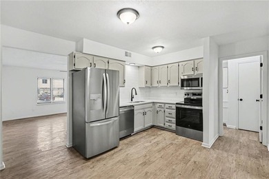 This beautifully updated 1.5-story interior-unit townhome blends - photo 7