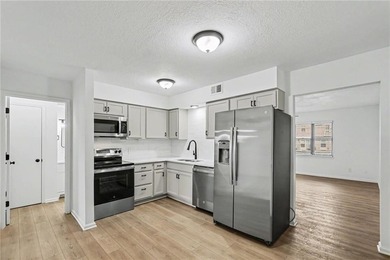 This beautifully updated 1.5-story interior-unit townhome blends - photo 7