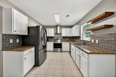 Set on a quiet cul-de-sac, 41 Lakeside Drive offers a sense of - photo 9