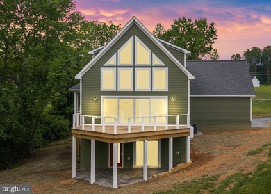 Enjoy elevated lakefront living in this brand-new - photo 1