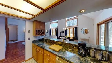 Step into this warm and inviting 3-bedroom, 2-bath chalet - photo 14