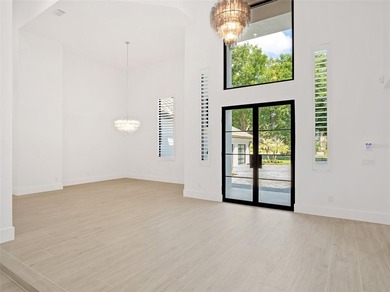 Set within the gates of renowned Isleworth, this beautifully - photo 6