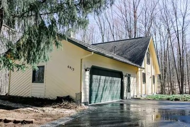 Step into this warm and inviting 3-bedroom, 2-bath chalet - photo 38