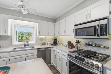 Pull up to your nautical blue piling home on Pine Island and