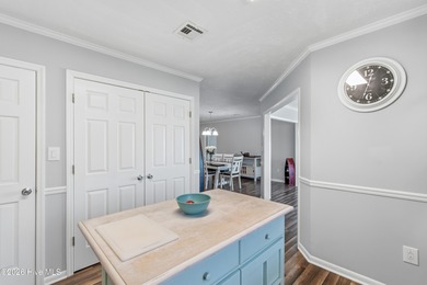 Pull up to your nautical blue piling home on Pine Island and