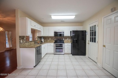 This spacious 5-bedroom, 3-bath home has been freshly painted - photo 13