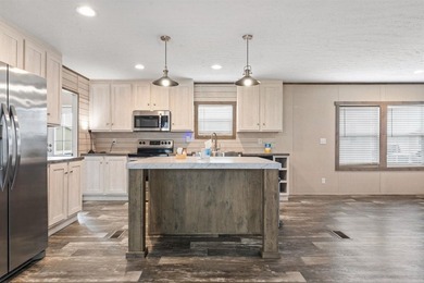 Step inside this beautiful 4-bedroom, 2-bath manufactured home - photo 5
