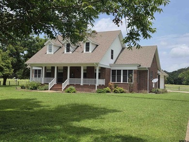 This stunning two-story home is situated on 46.761 acres in the - photo 1