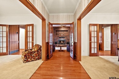 This stunning two-story home is situated on 45 acres in the - photo 3