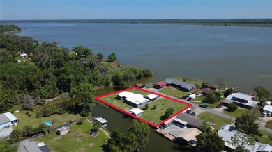 Waterfront -- Situated on an oversized corner canal lot with - photo 1