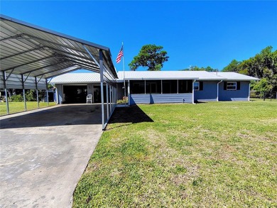 Waterfront -- Situated on an oversized corner canal lot with - photo 2