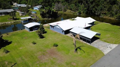 Waterfront -- Situated on an oversized corner canal lot with - photo 5
