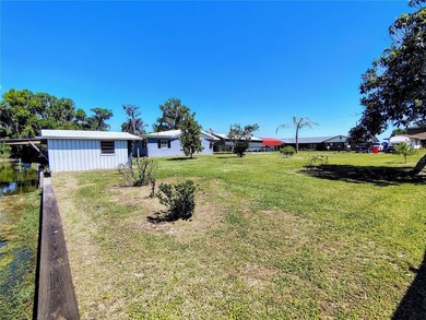 Waterfront -- Situated on an oversized corner canal lot with - photo 7