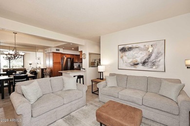 Ideal interior location with south facing patios on the big - photo 4