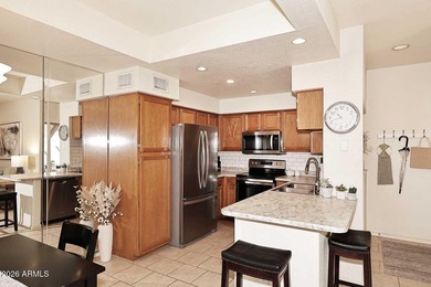 Ideal interior location with south facing patios on the big - photo 9