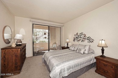 Ideal interior location with south facing patios on the big - photo 10