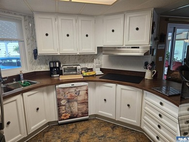 Very well kept home in Juniper Mobile Estates. This home is - photo 11