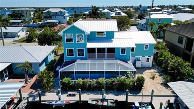 Custom Luxury Island Living! This stunning Matlacha home sits on - photo 1