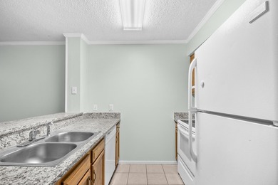 Discover coastal living at its best in Unit 303 at Eagle Lake, a - photo 9