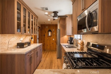 This charming 2-bedroom, 1-bath cabin sits on a quiet street in - photo 4