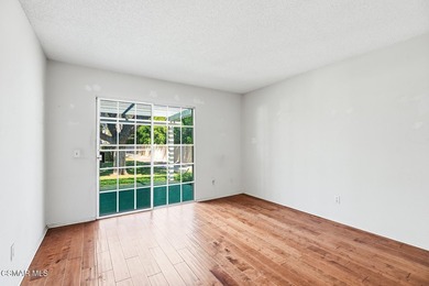 Highly desirable Cape Cod single story end unit! This charming