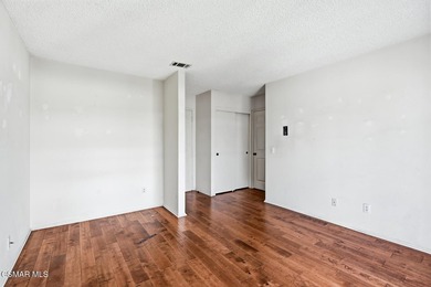 Highly desirable Cape Cod single story end unit! This charming