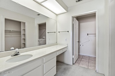 Highly desirable Cape Cod single story end unit! This charming