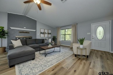 Nestled on a quiet street, this inviting residence blends - photo 2