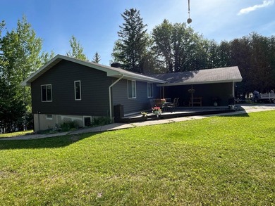 This spacious 5-bed, 3-bath walk-out home on Rainy River offers - photo 2