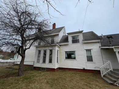 This handsome three-story Victorian residence offers historical