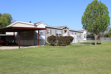 BEAUTIFUL HOME ON TWO PLUS MANICURED ACRES. HOME HAS BEEN