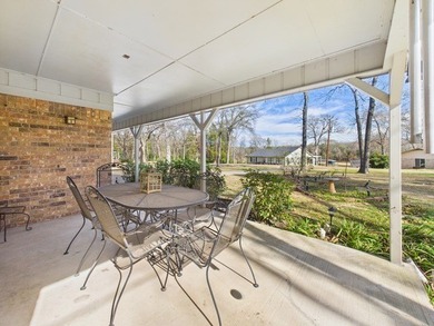 Tucked beneath a canopy of mature trees in the heart of