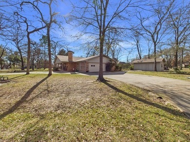 Tucked beneath a canopy of mature trees in the heart of