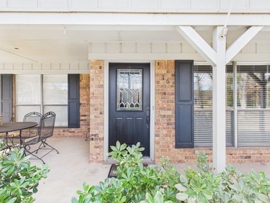 Tucked beneath a canopy of mature trees in the heart of