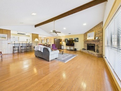 Tucked beneath a canopy of mature trees in the heart of