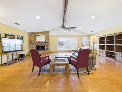 Tucked beneath a canopy of mature trees in the heart of