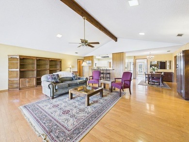 Tucked beneath a canopy of mature trees in the heart of